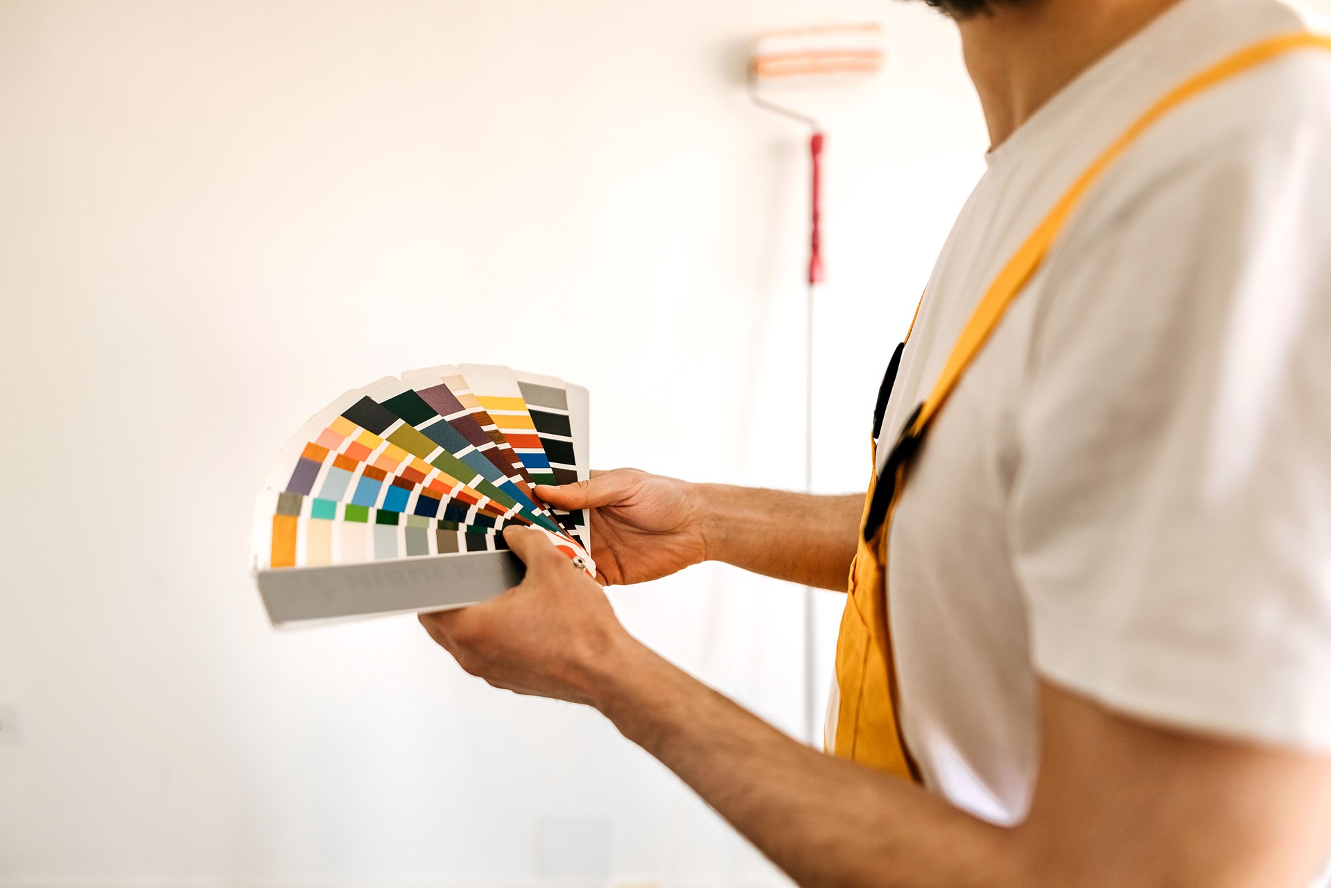 Painter picking colours for wall