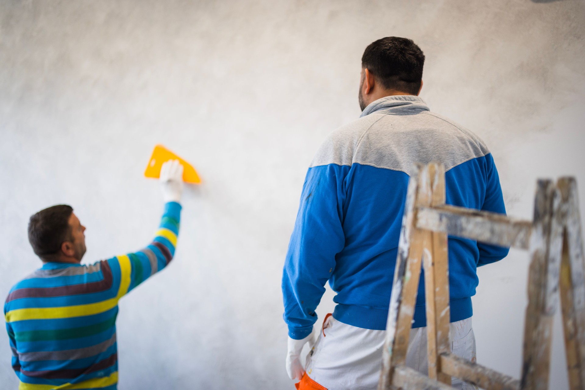 Construction worker doing inside walls